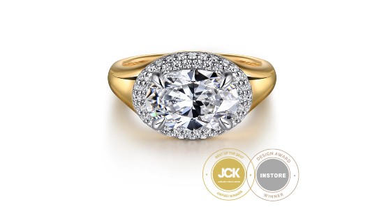 a mixed metal engagement ring with a large center stone and double halo