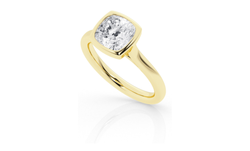 A bezel-set solitaire engagement ring with a cushion cut center stone from Flashpoint Created Diamonds, available at Morgan Jewelers.