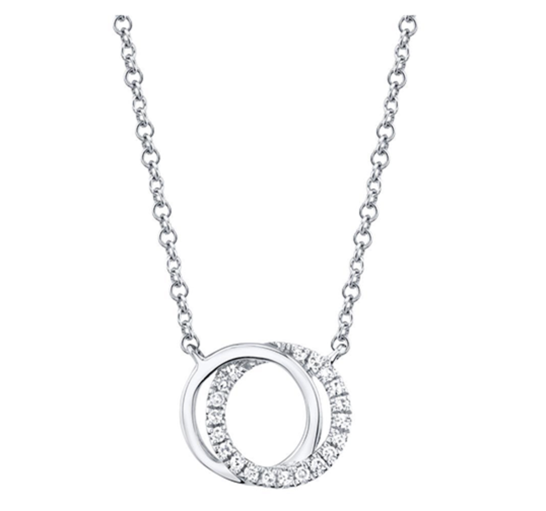A white gold round diamond pendant