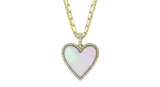 A yellow gold pendant necklace with a mother of pearl heart, available at Morgan Jewelers.