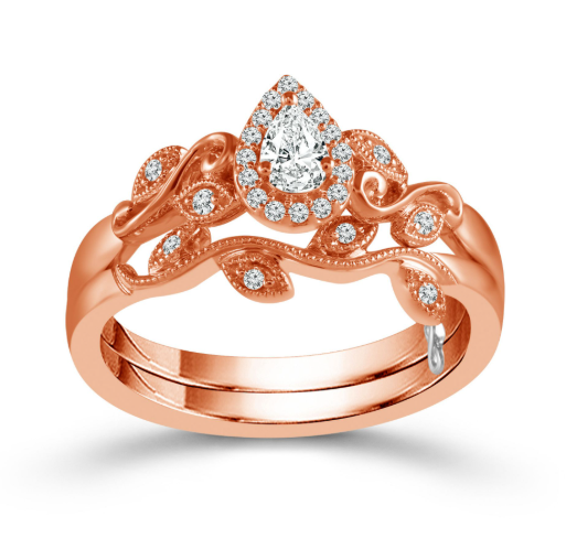 A rose gold floral engagement ring with pear shaped at the center.