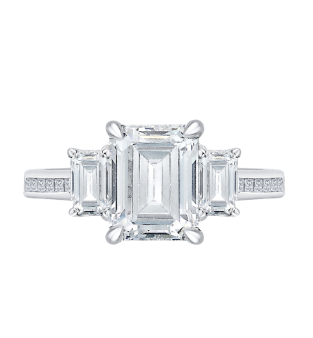 A white gold emerald cut three stone engagement ring