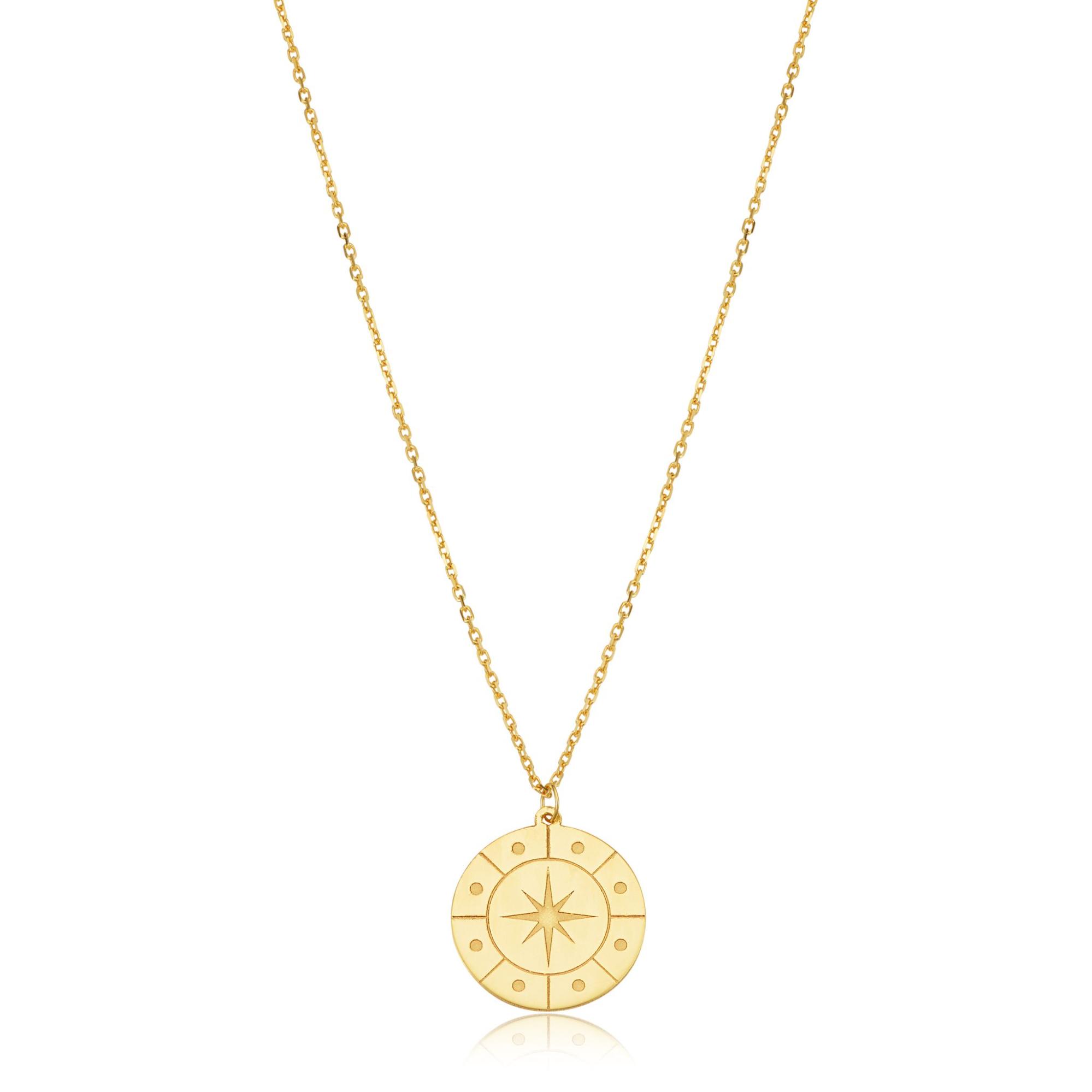 A yellow gold compass disk pendant.