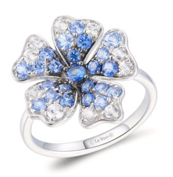 A white gold floral shaped white and deep blue gemstone ring