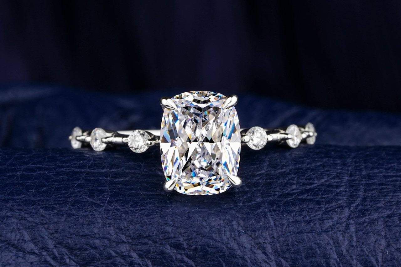 a diamond engagement ring on a black background a diamond engagement ring on a black background
