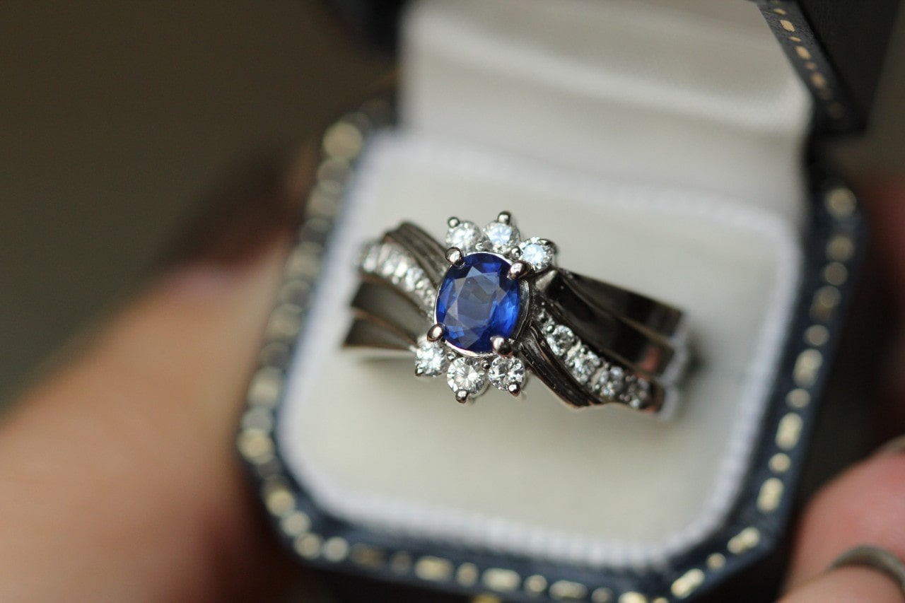 A sapphire fashion ring with diamond accents in a luxurious ring box