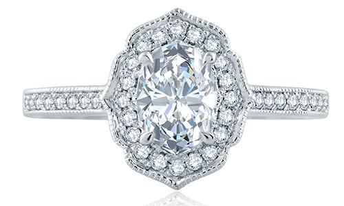 A.JAFFE’s Art Deco engagement ring features a blooming halo with an oval center stone