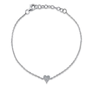 A heart pendant bracelet with pave set diamonds covering the heart