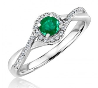 An emerald fashion ring from Morgan Jewelers’ in-house brand features a round-cut emerald and sterling silver