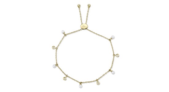 A yellow gold pearl and diamond station bracelet by Shy Creation