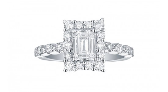 An emerald cut engagement ring in a halo setting