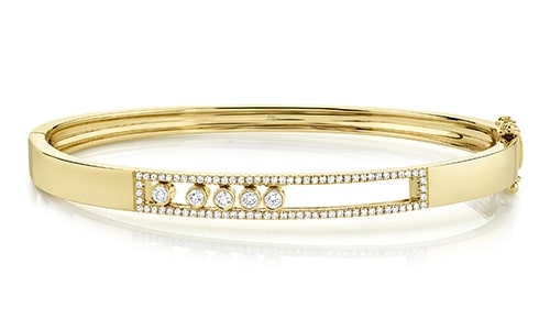A gold bangle with diamond accents from Shy Creation