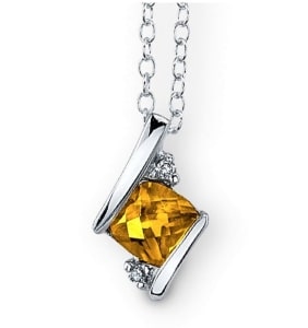 A cushion-cut citrine pendant with diamond accents set in sterling silver.