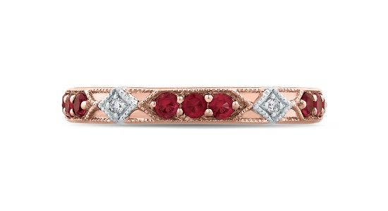 a mixed metal wedding band featuring rubies and diamonds