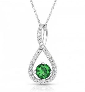 An emerald and diamond pendant from our in-house collection.