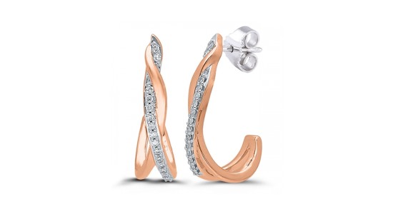 a pair of mixed metal diamond earrings with a ribbon silhouette